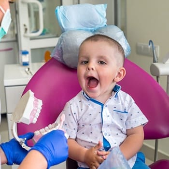 Young toddler getting a dental exam