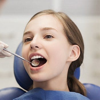 Young girl receiving dental exam