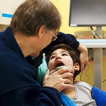 Boy receiving dental exam