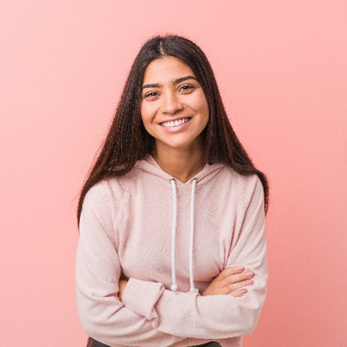 Closeup of teen in pink jacket smiling