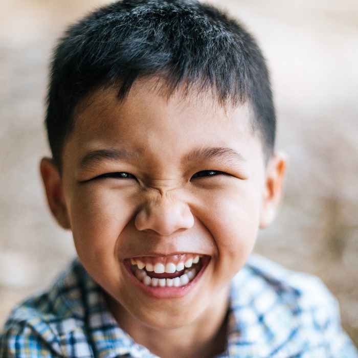 smiling child playing outside