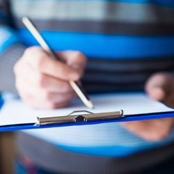 Patient filling out a dental insurance form