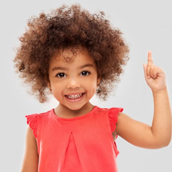 Child pointing her finger upwards like she has a great idea