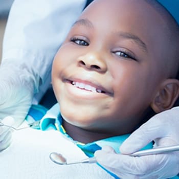 Smiling young boy in dental chair