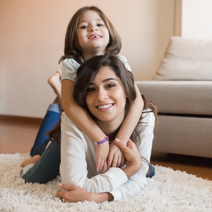 Smiling mother and daughter