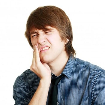 A young man with tooth pain.