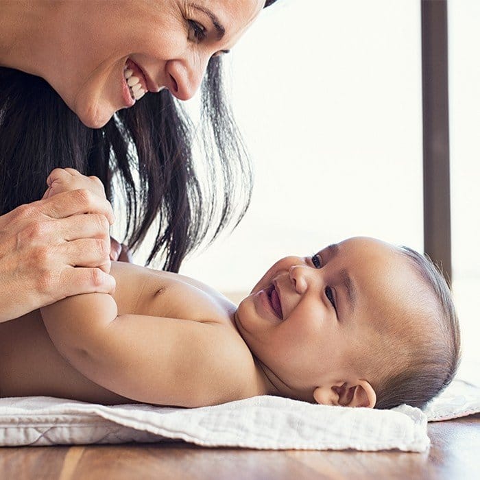 Mother and laughing baby