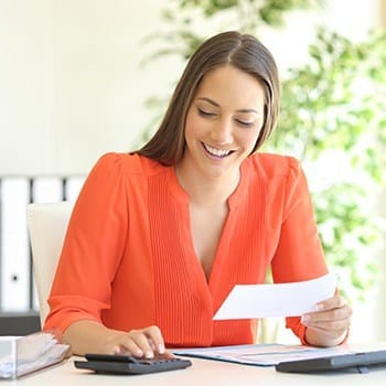 Woman looking at dental insurance paperwork