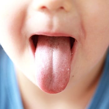 Child sticking out their tongue