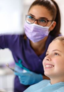 Wolf Creek pediatric dentist explaining X-ray to patient