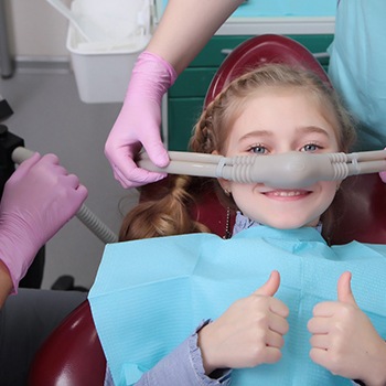 A little girl receiving nitrous oxide sedation