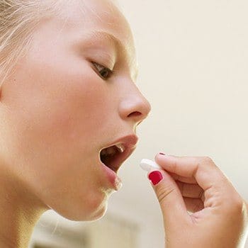 Patient taking an oral sedative pill