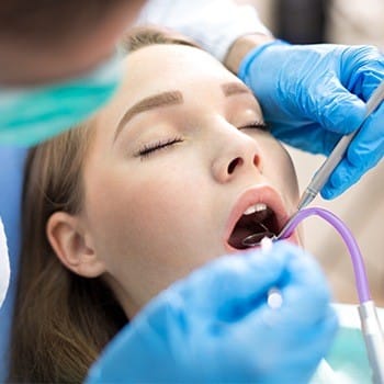 Relaxed patient receiving dental treatment