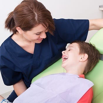 Laughing child in dental chair