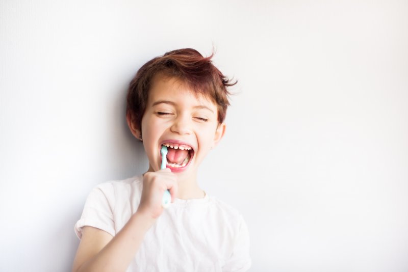 Child brushing his teeth