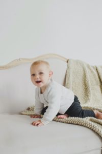 Young baby on sofa