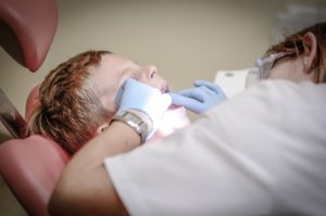 Young boy undergoing a dental procedure